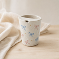 Hand Painted Bow Ceramic Travel Mug, Coquette Pottery Tumbler with Sip Opening, Pink and Blue Ribbon Coffee Cup