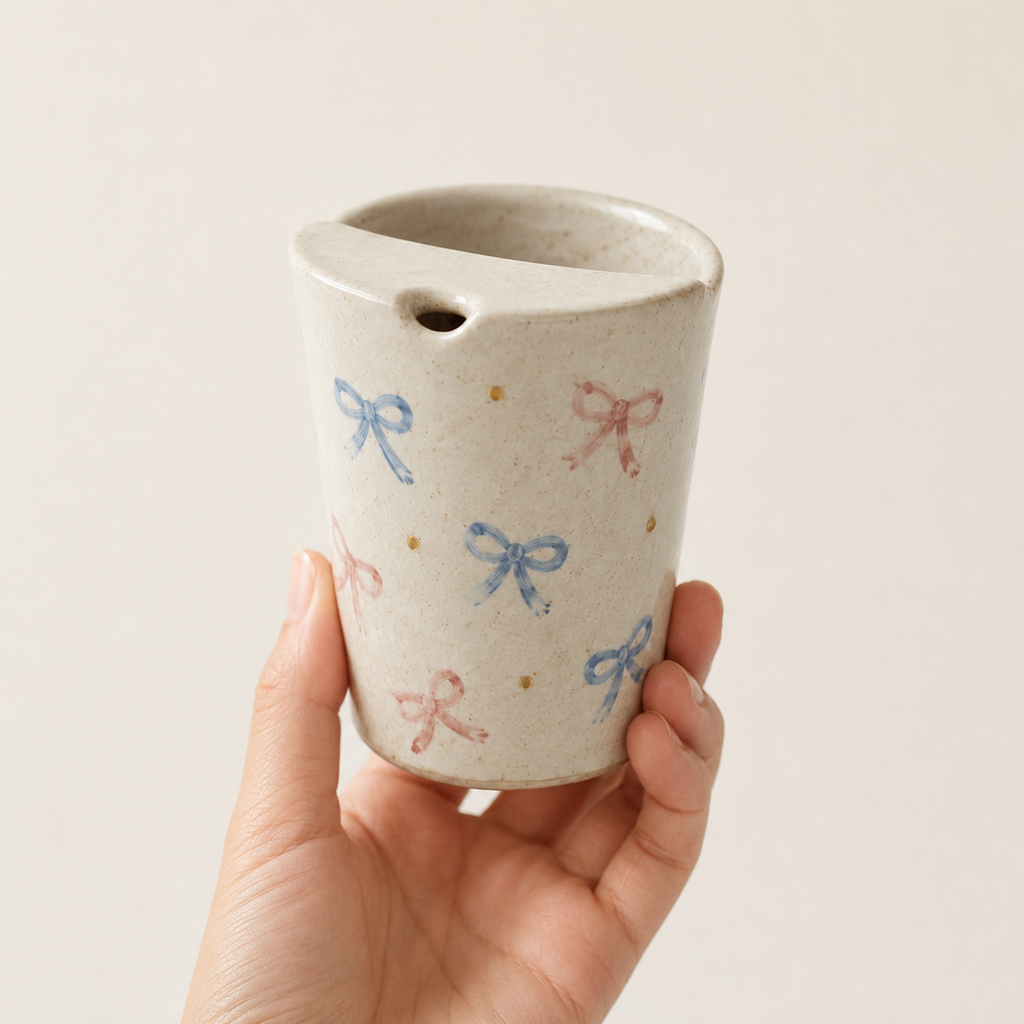 Hand Painted Bow Ceramic Travel Mug, Coquette Pottery Tumbler with Sip Opening, Pink and Blue Ribbon Coffee Cup
